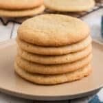 A pile of old fashioned tea cakes, on a plate, the image is cropped square.