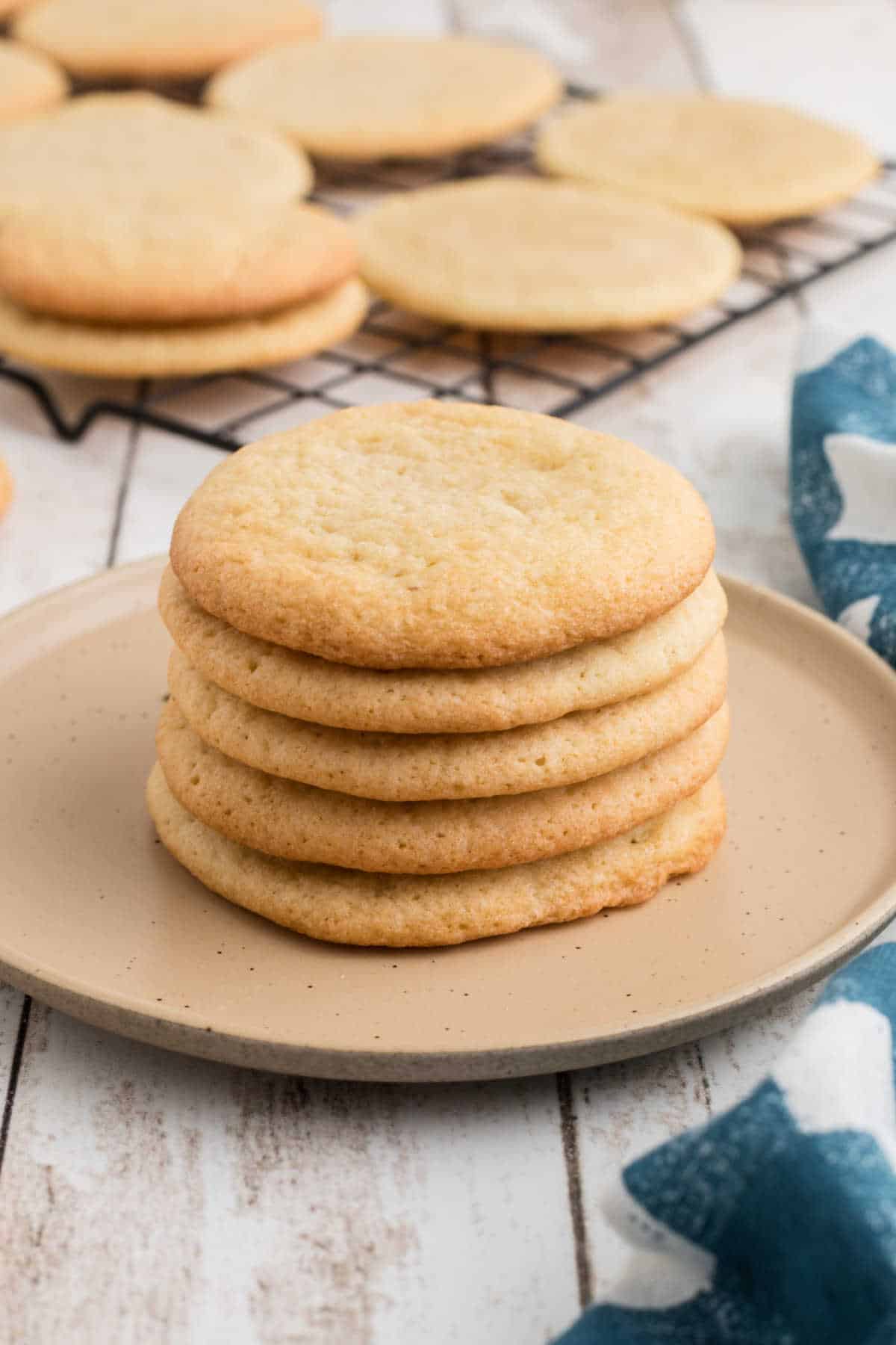 A pile of old fashioned tea cakes on a plate.