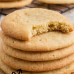 Long image of a stack of tea cakes, with a bite taken out of the top one.