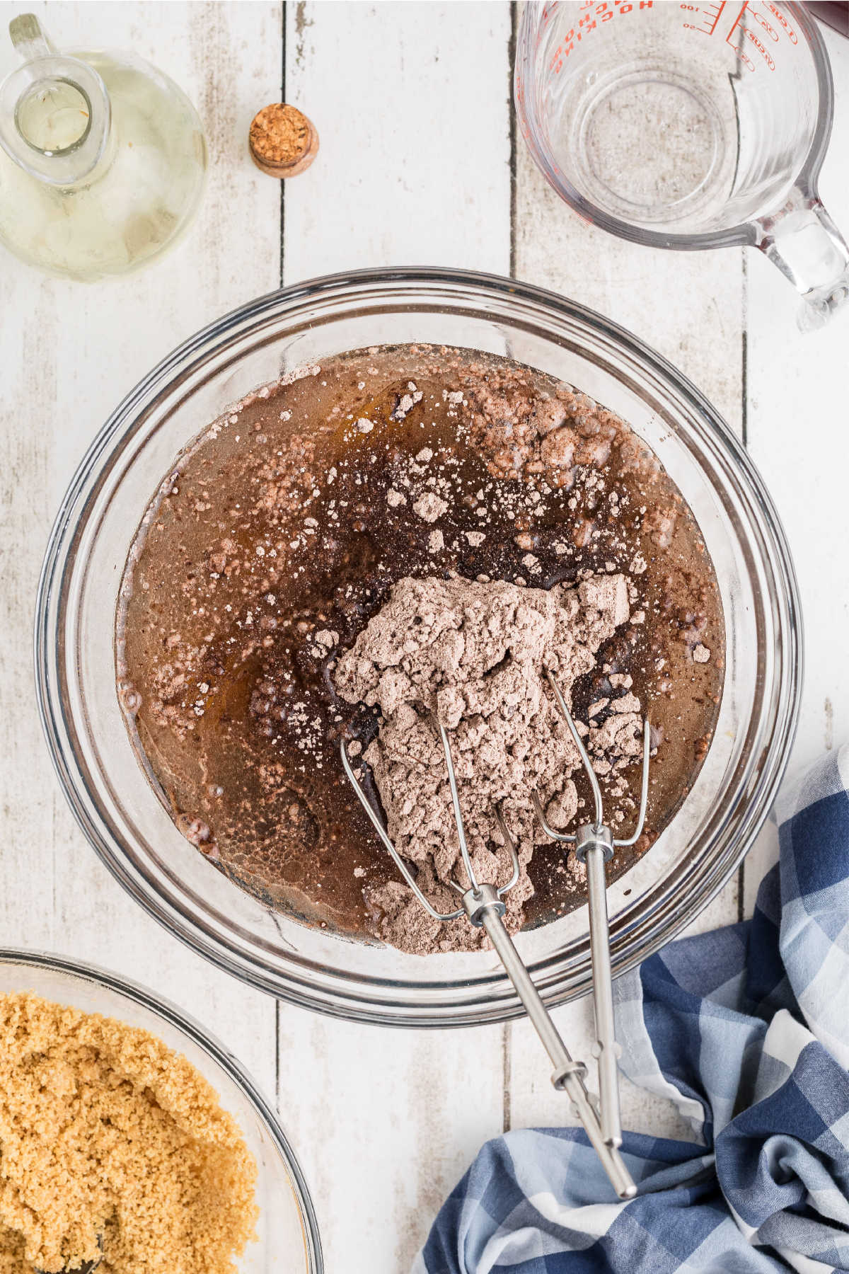 A large mixing bowl filled with cake mix and other ingredients.