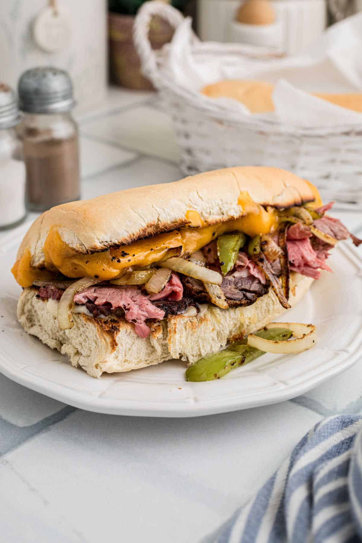 A prime rib sandwich stuffed with leftover prime rib, peppers and onions, melted cheese and horseradish.