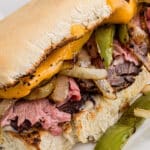 Close up long image of a prime rib sandwich, with text overlay for Pinterest.