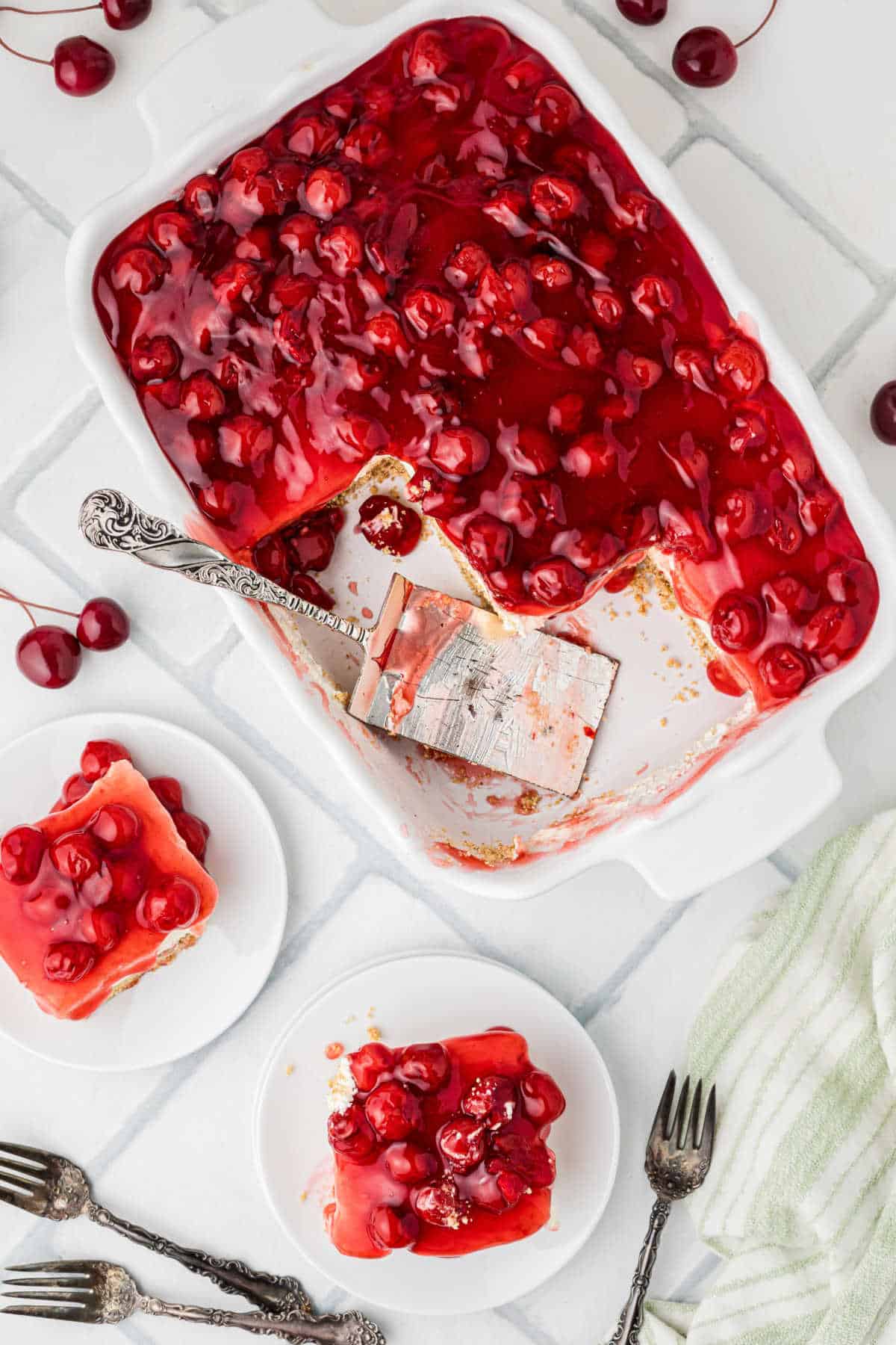 Overhead shot of a dish of old fashioned cherry delight, with some plated up.