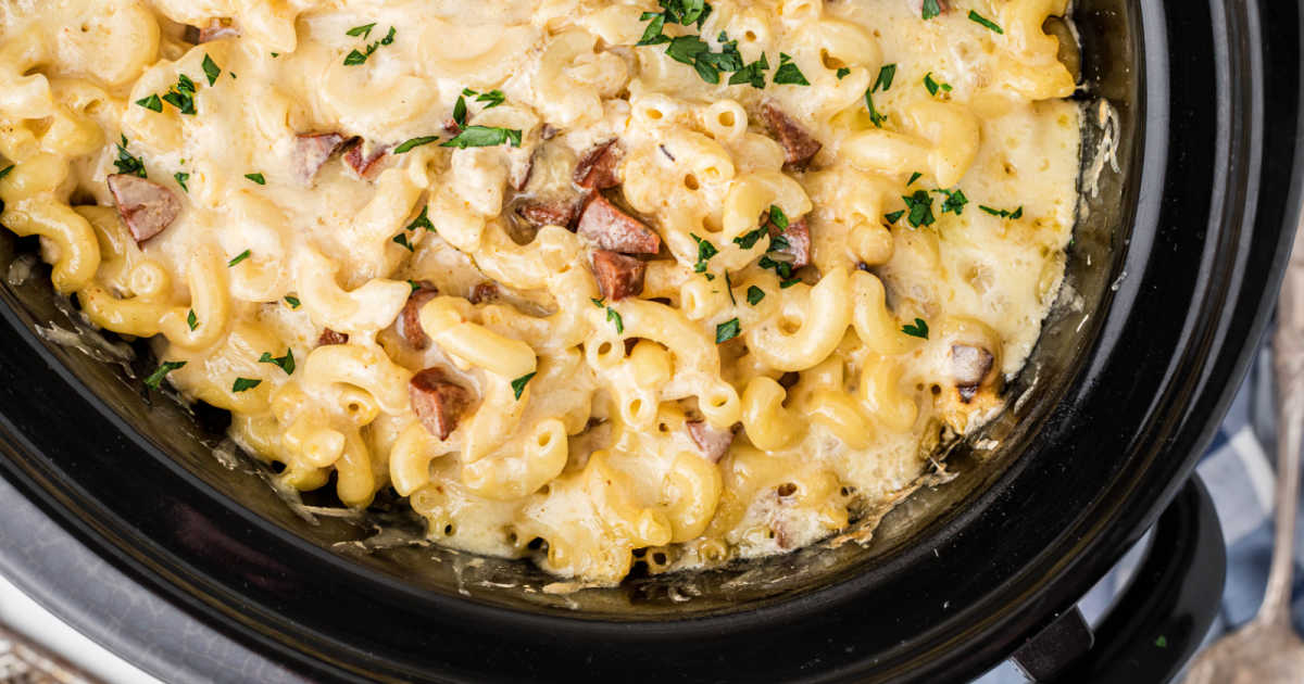 Close up of some Cajun mac and cheese in a crock pot.