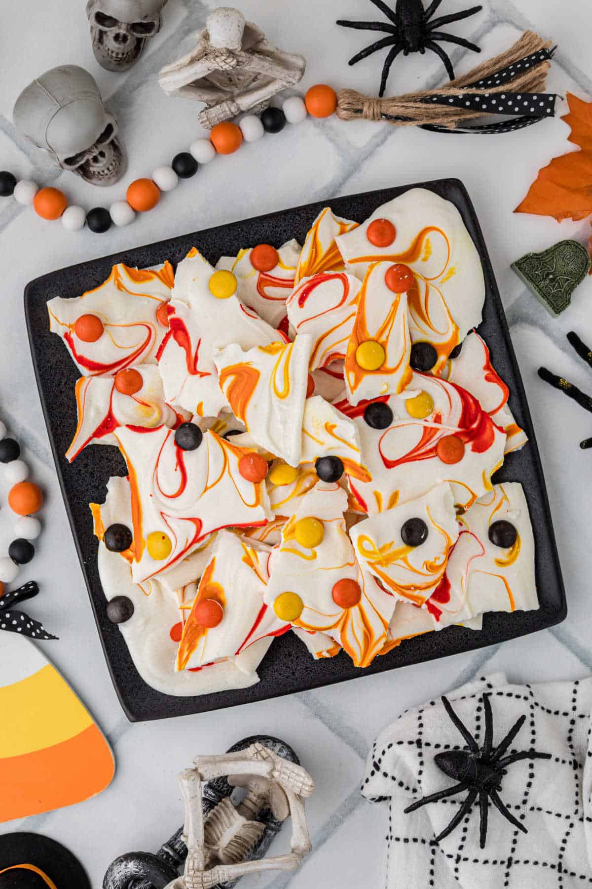 An overhead picture of Halloween bark, decorated with spooky decorations all around.