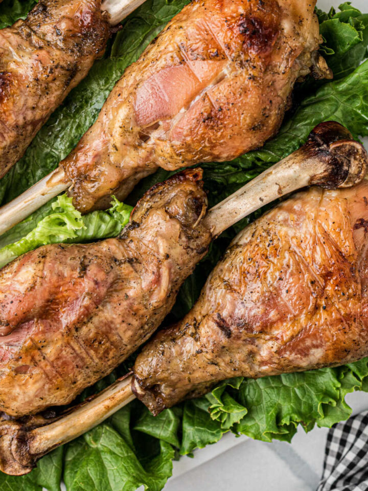 Southern Baked Turkey Legs on a bed of lettuce.