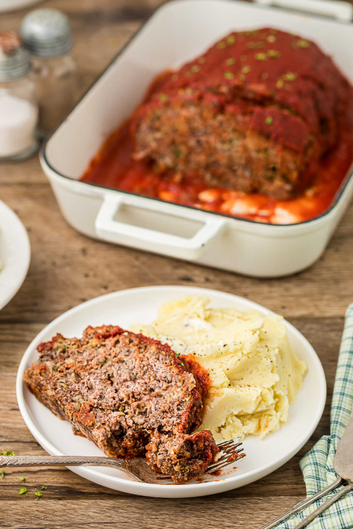 Dished up plate of Cajun meatloaf with mashed potatoes.