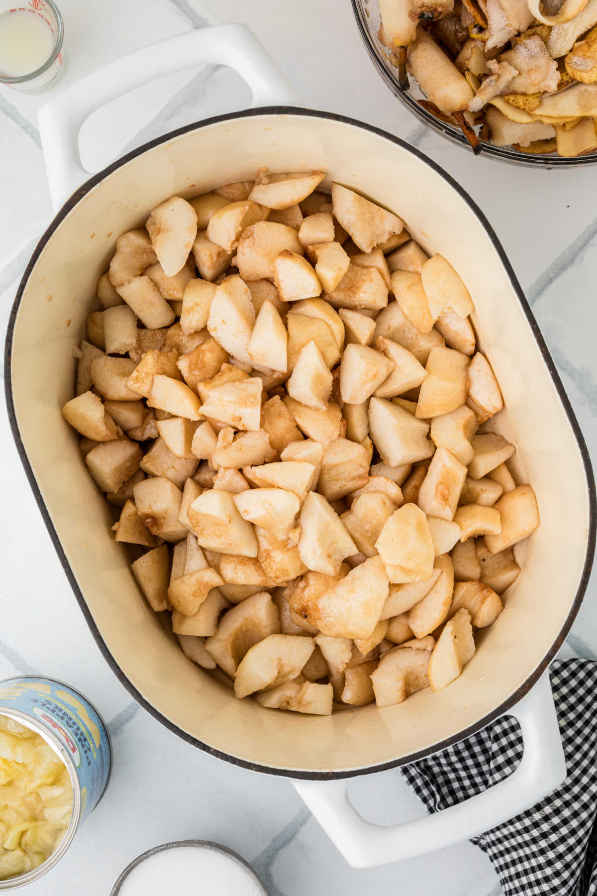 A large pot filled with pieces of pear.
