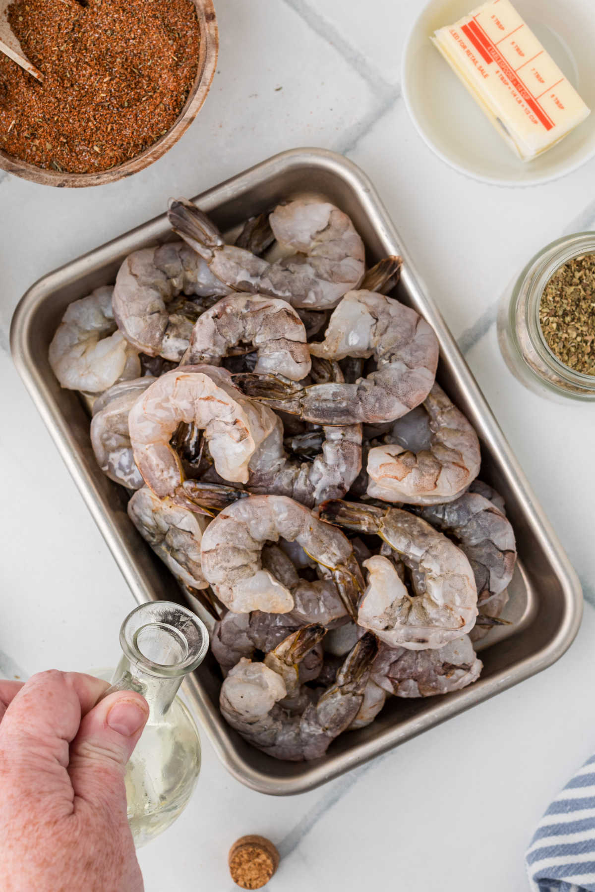 Shrimp that has been peeled and dried having oil poured all over.