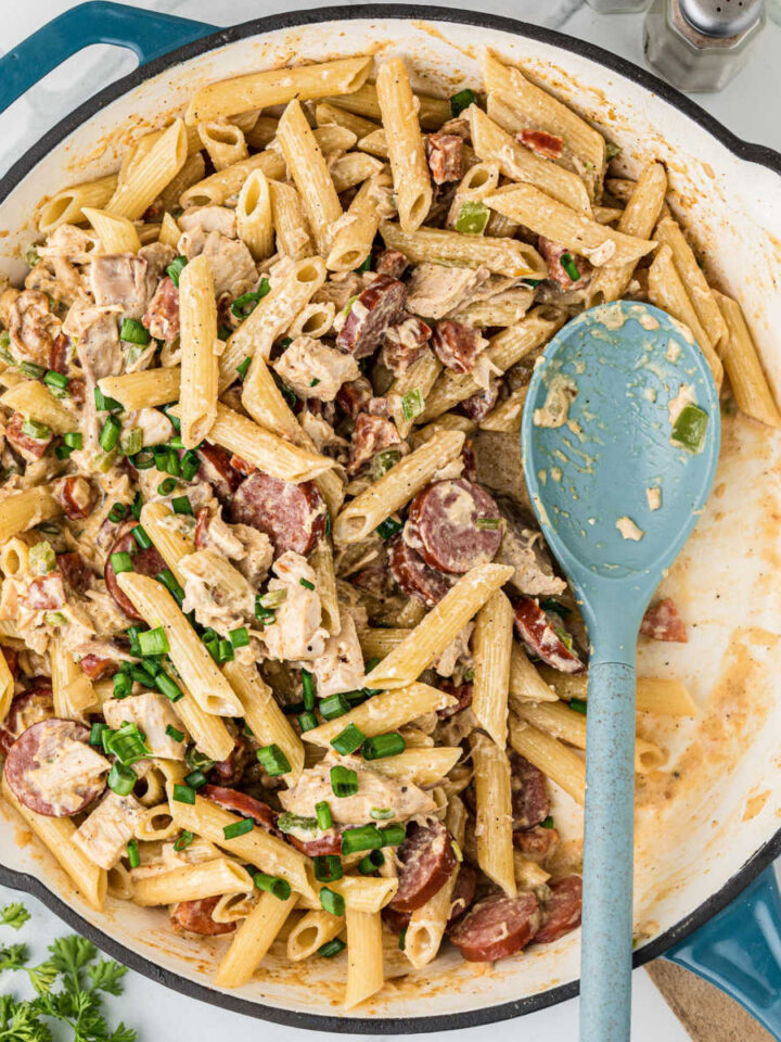 A large skillet filled with Cajun Chicken and Sausage pasta.