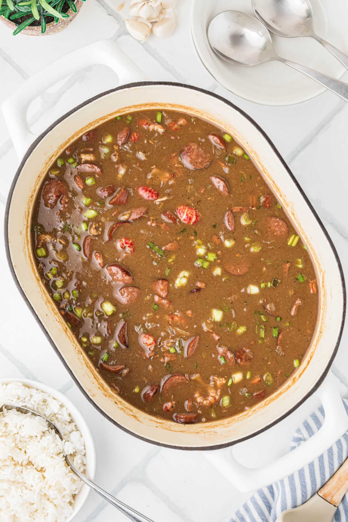 Overhead shot of a large pot of crawfish gumbo.