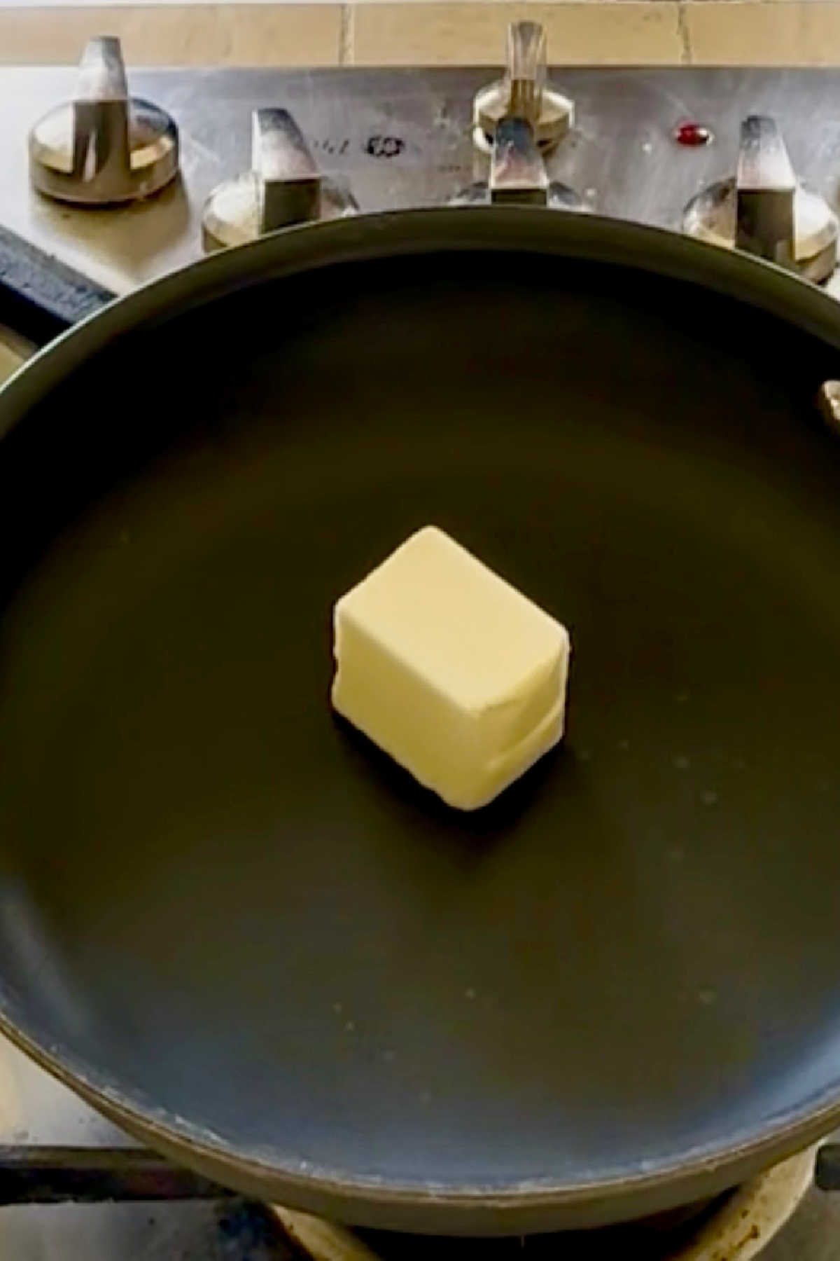 Butter added to a skillet.