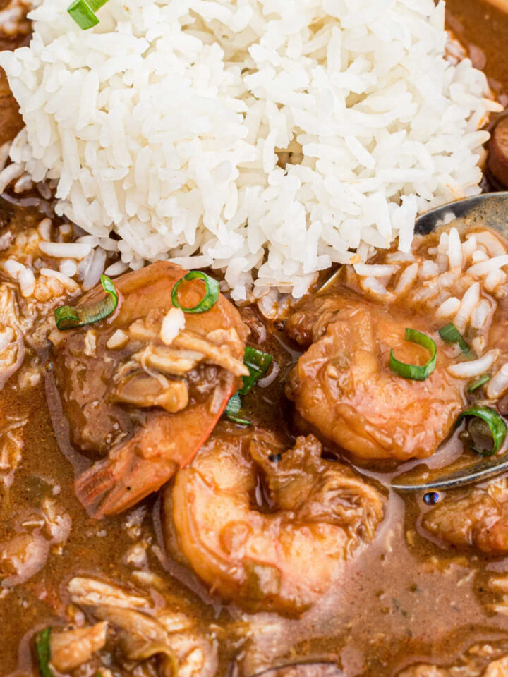 Close up shot of a bowl of Louisiana Seafood Gumbo, with some white rice.