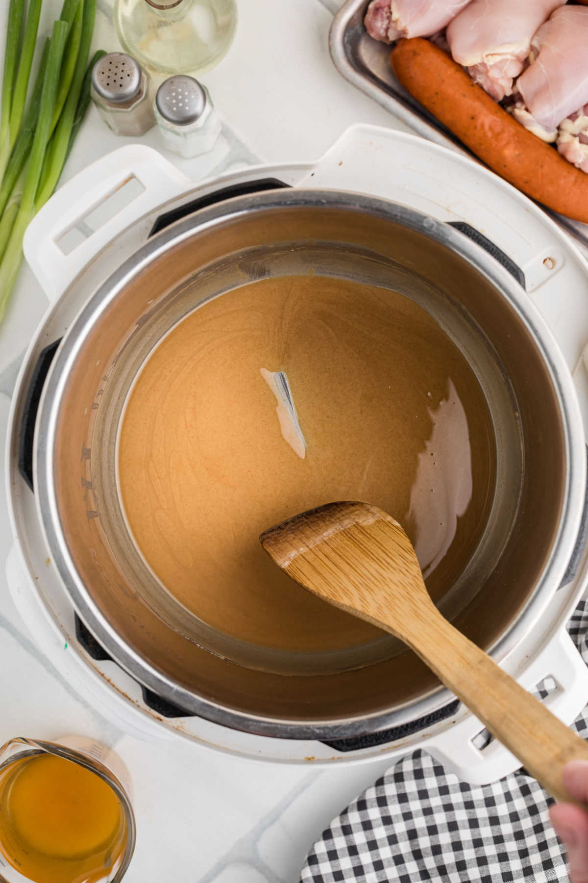 Overhead shot of the inside of an instant pot, with a roux cooking.